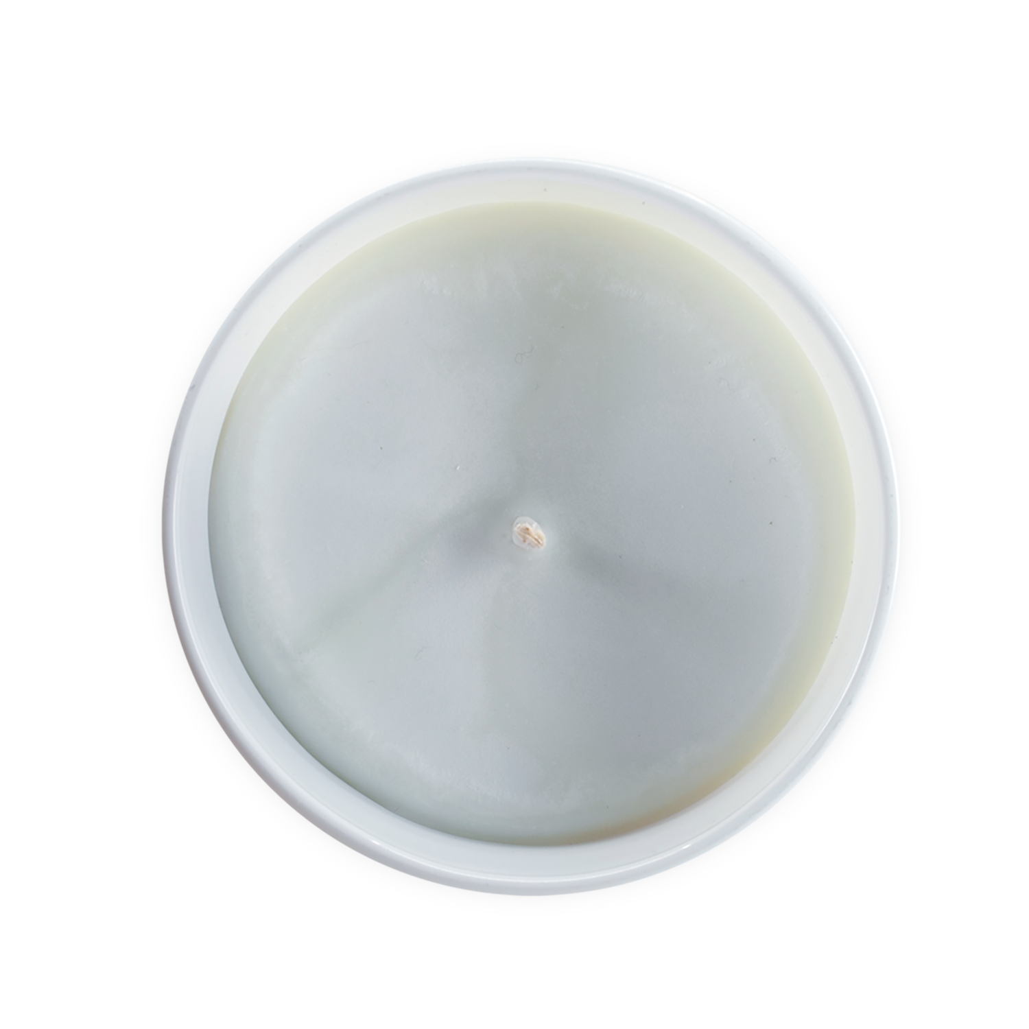 Top view of a white candle on a black background