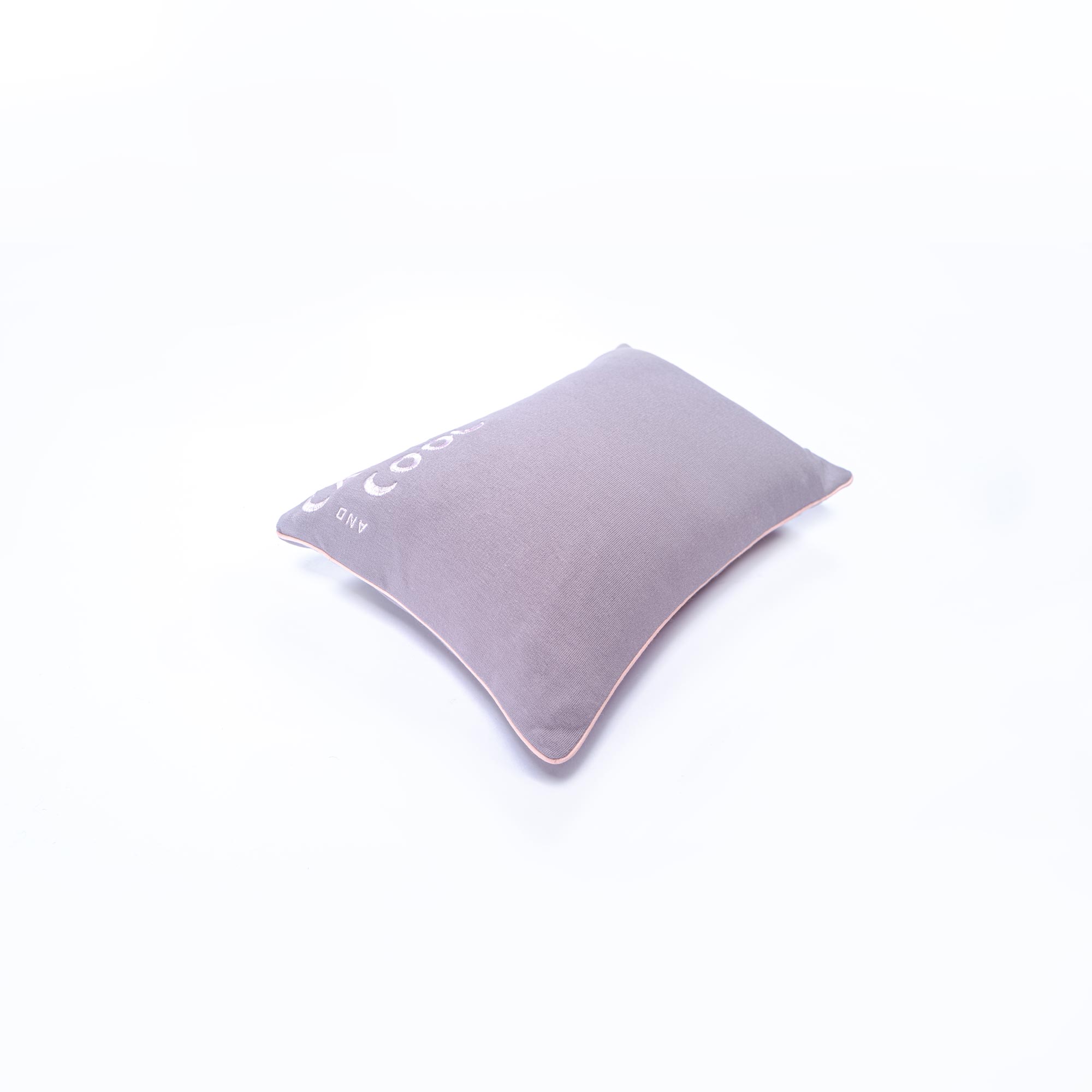 Gray ergonomic lumbar support cushion on white background