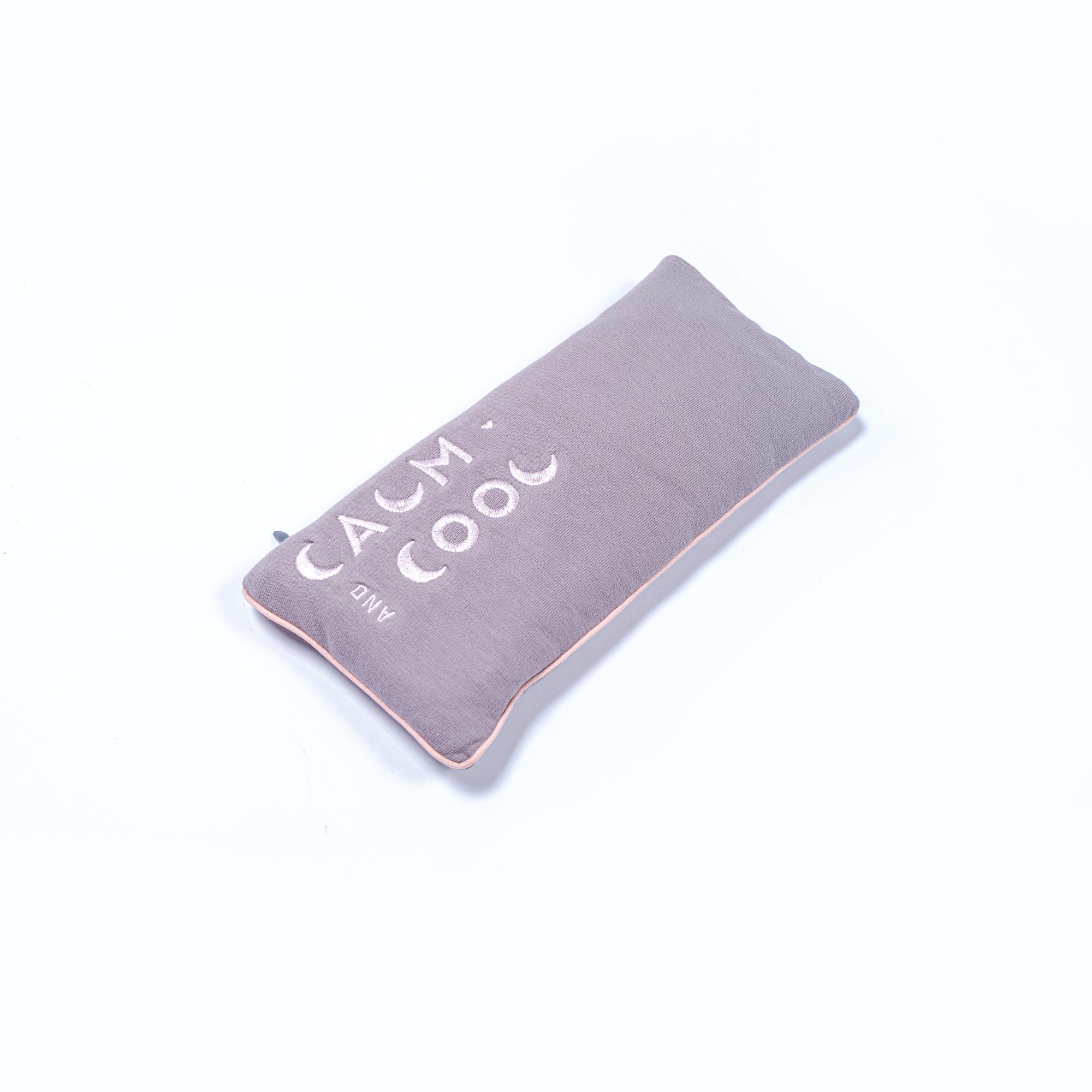 Gray rectangle pillow with calm and cool lettering on fabric