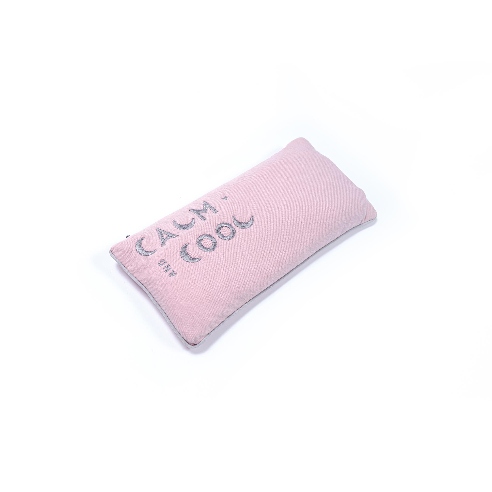 Pink rectangular pillow with calm and cool text design.