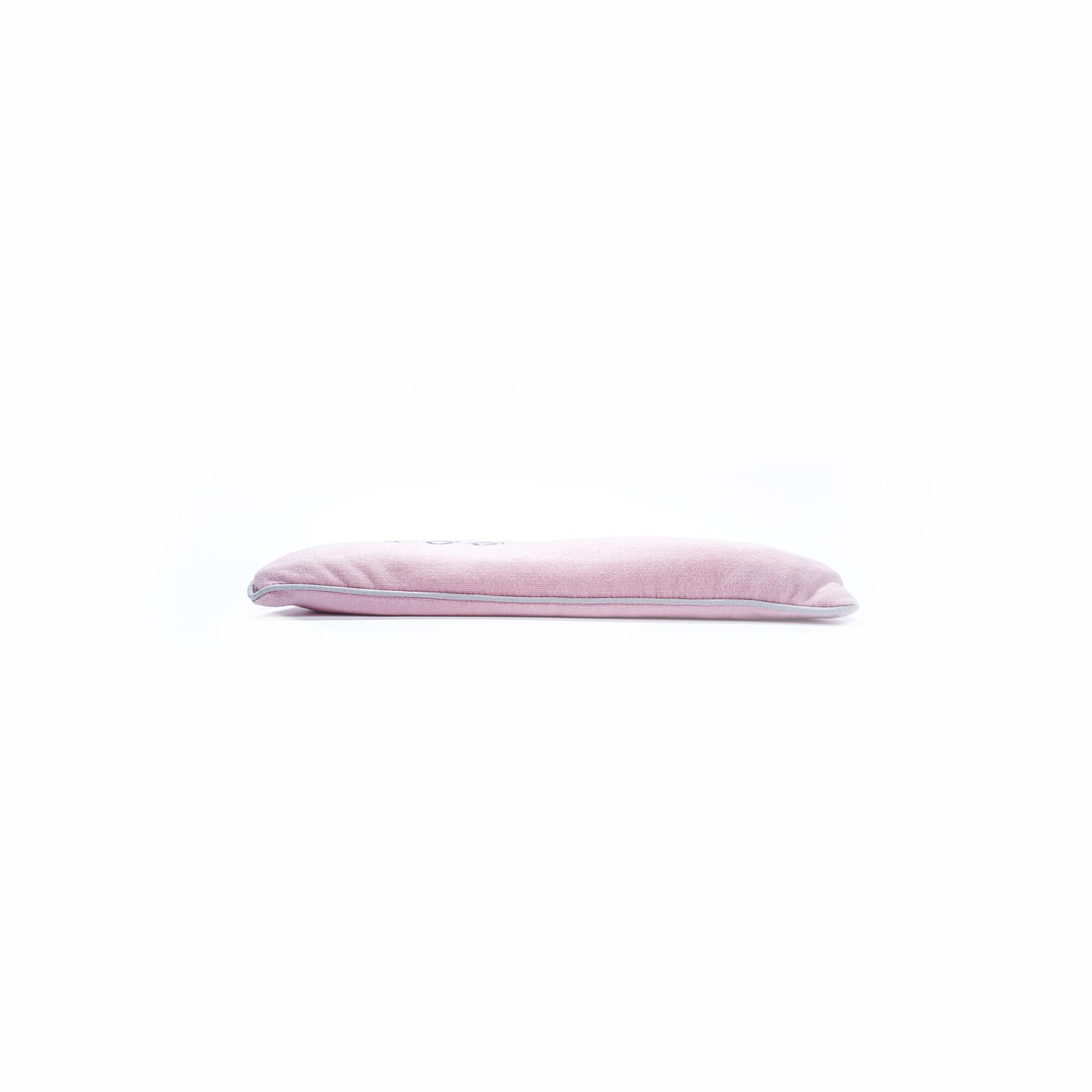 Soft pink velvet cushion on white background