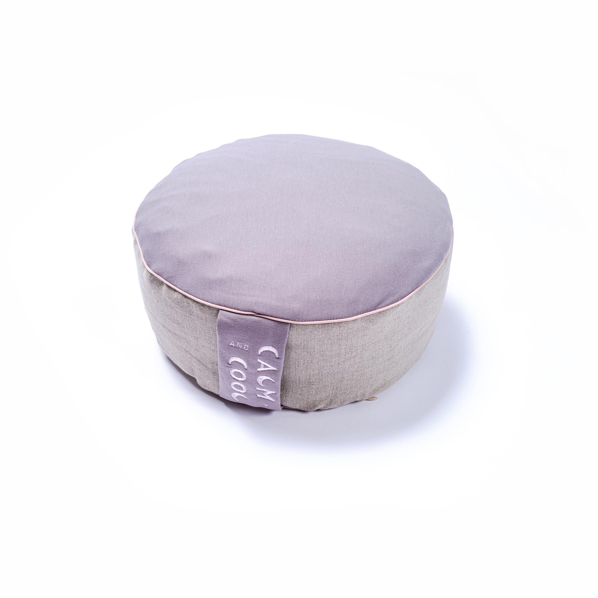 Gray round meditation cushion with calming message label