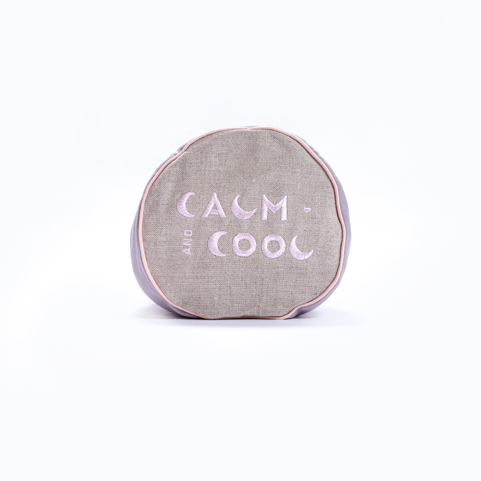 Round cushion with calming message on soft linen fabric
