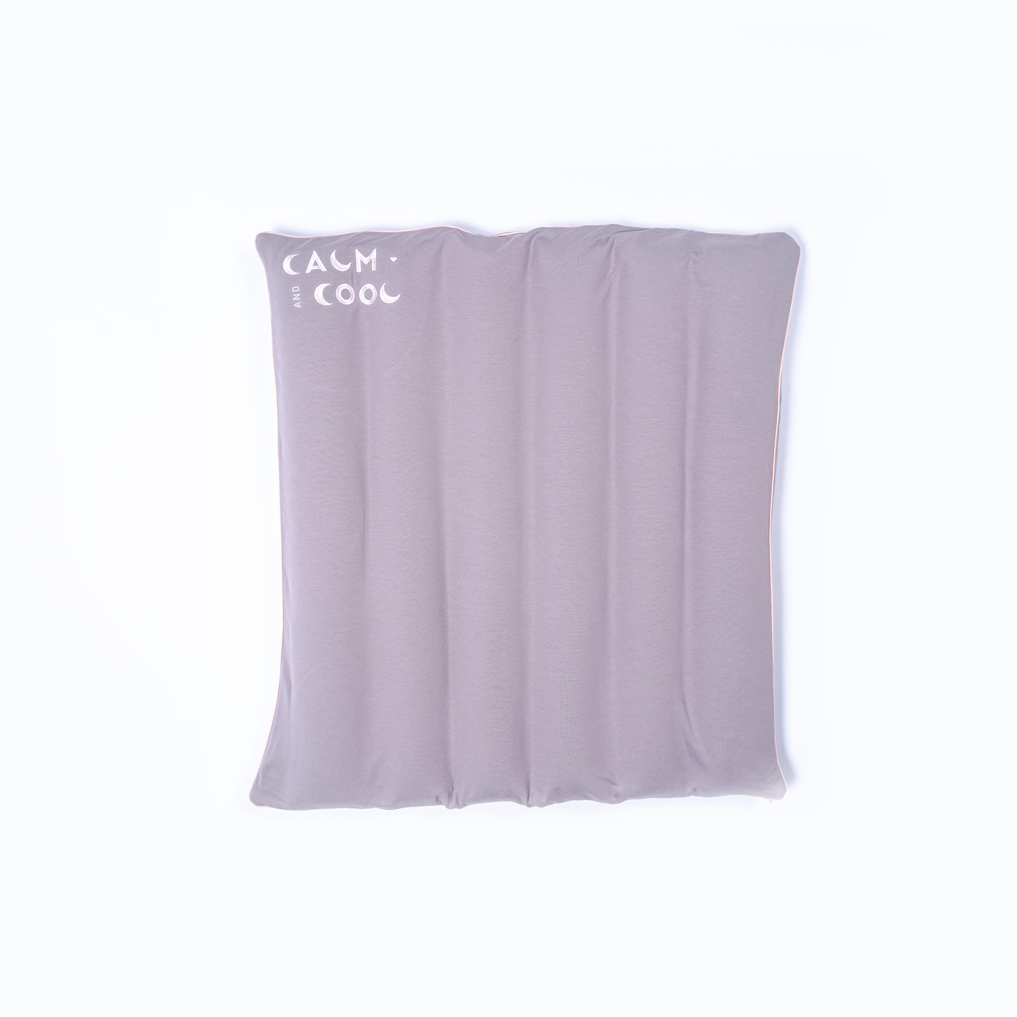 Gray cooling pillow with calming text design for relaxation