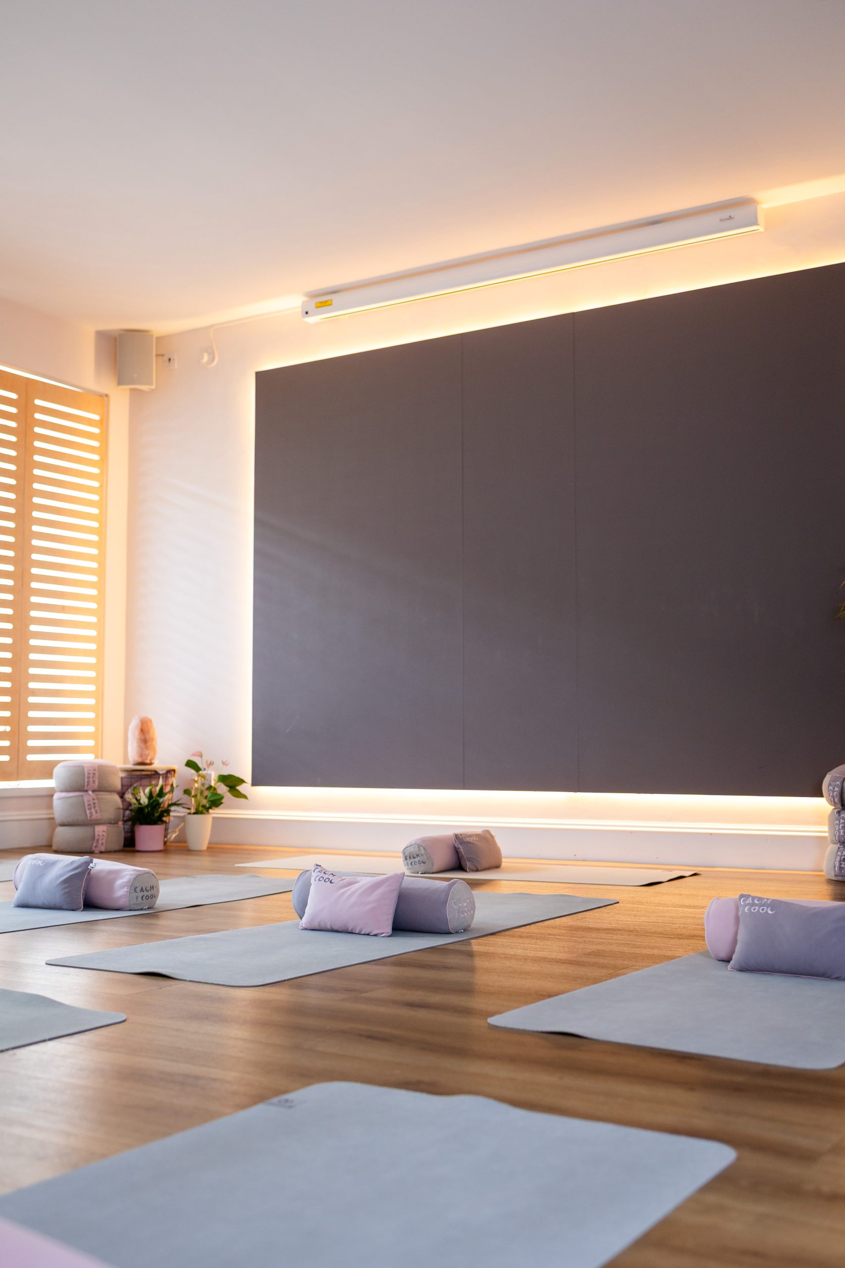 Peaceful yoga studio with mats and natural light. Peaceful yoga studio with mats and natural light.