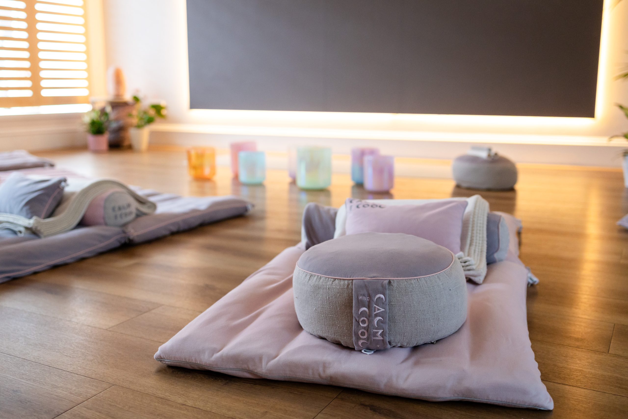 Yoga meditation room with cushions and soft lighting. Yoga meditation room with cushions and soft lighting.