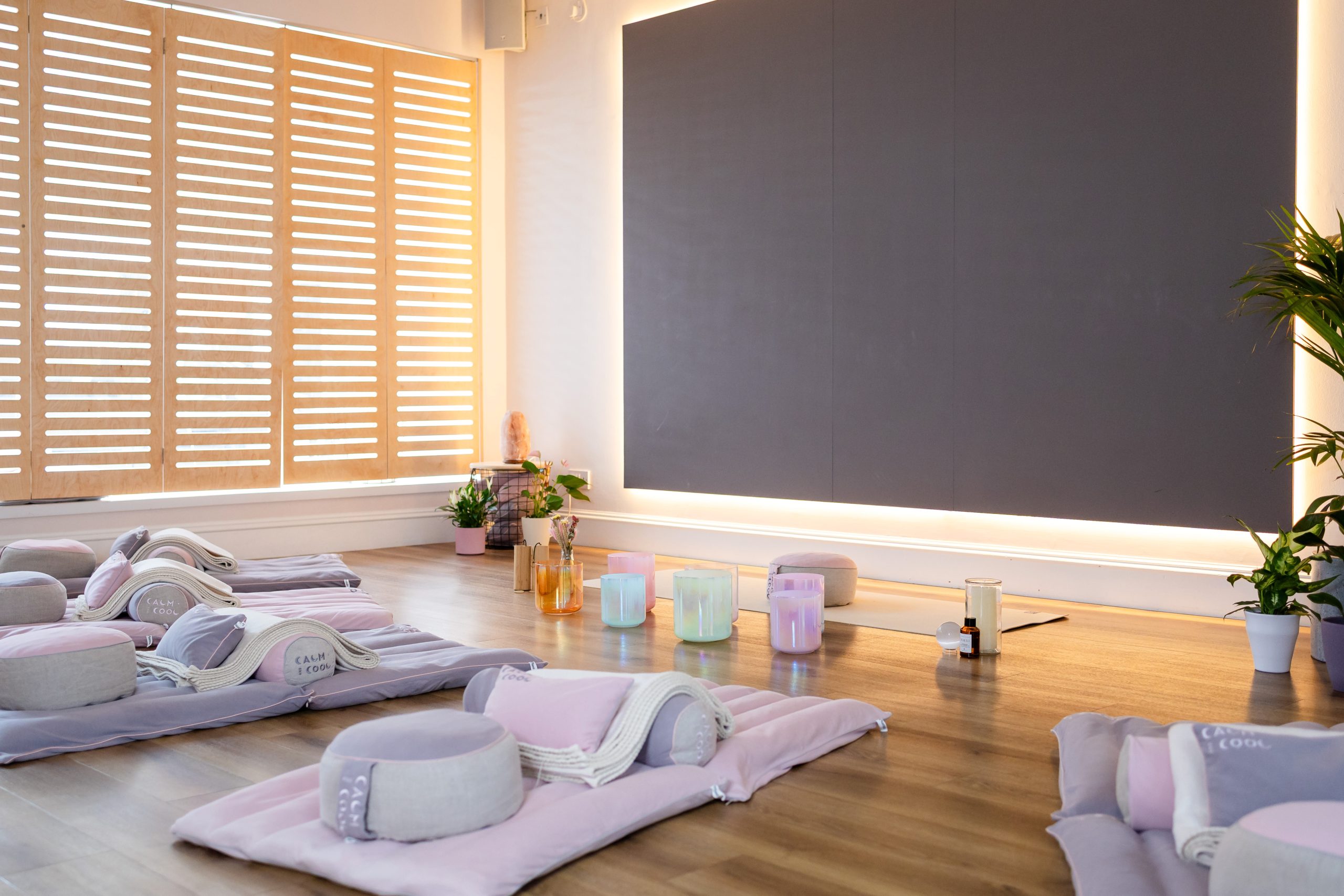Yoga studio with mats and cushions in a calm relaxing setting Yoga studio with mats and cushions in a calm relaxing setting