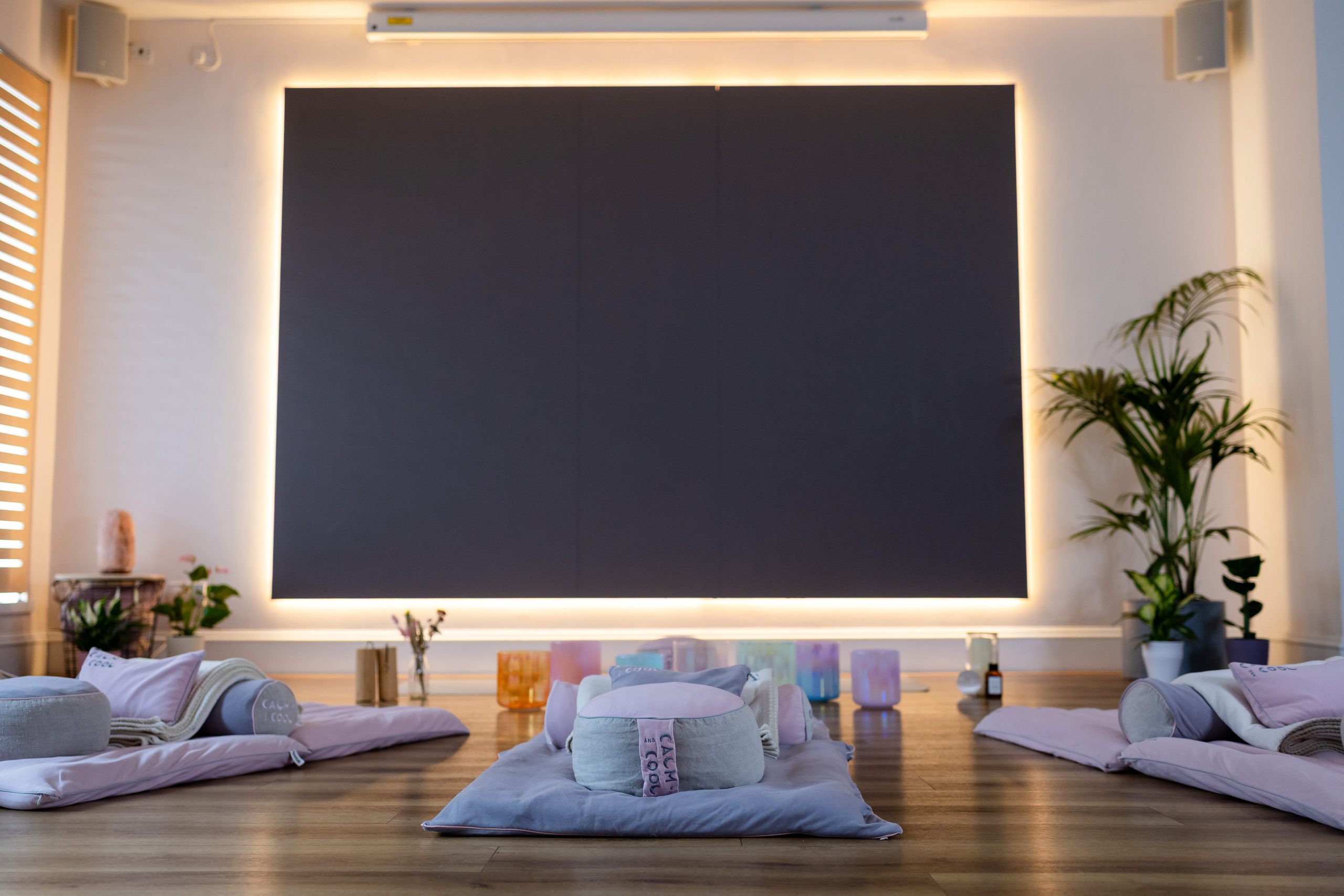 Peaceful yoga studio with mats and cushions for meditation