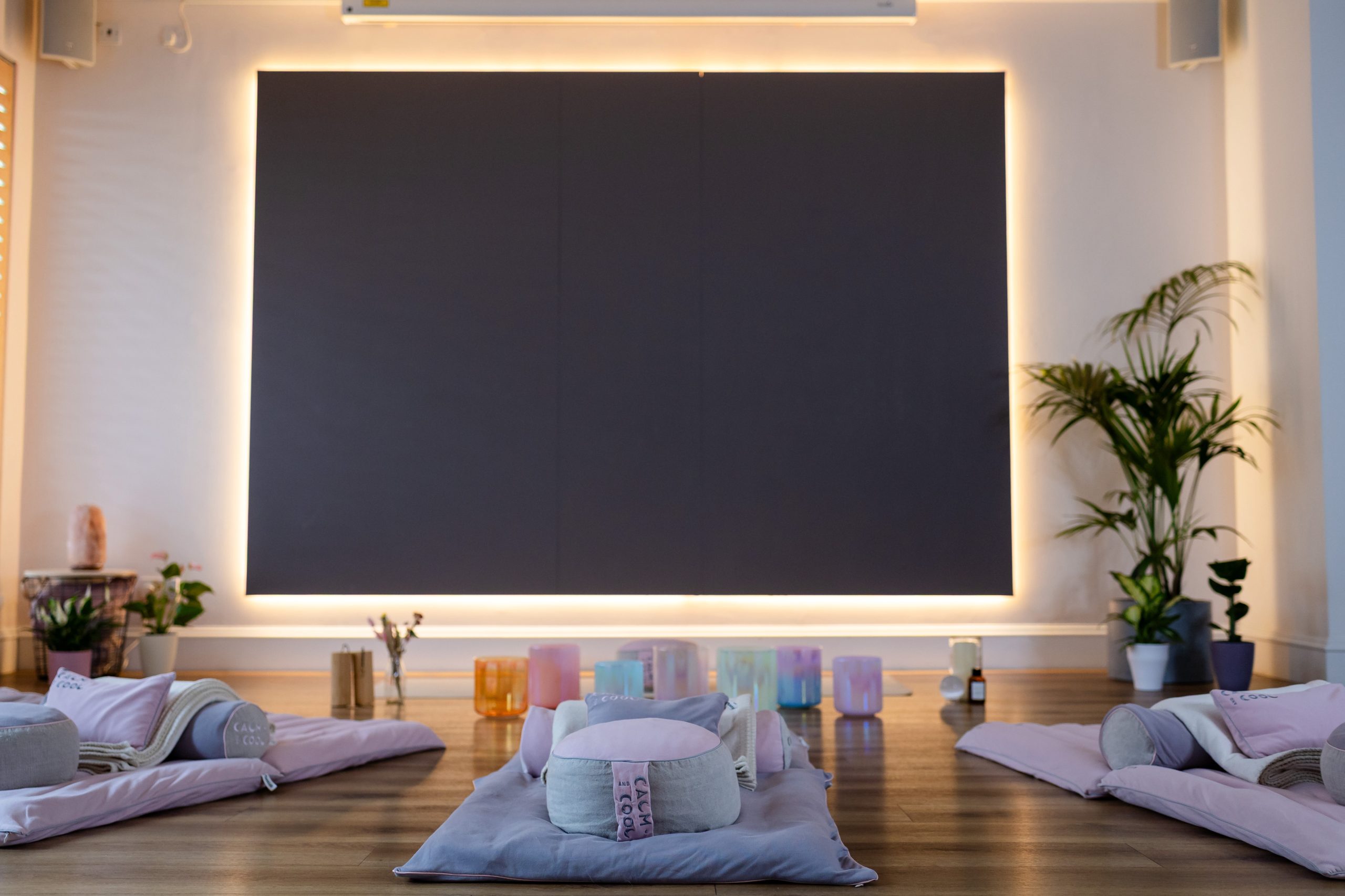 Cozy meditation room with cushions and ambient lighting