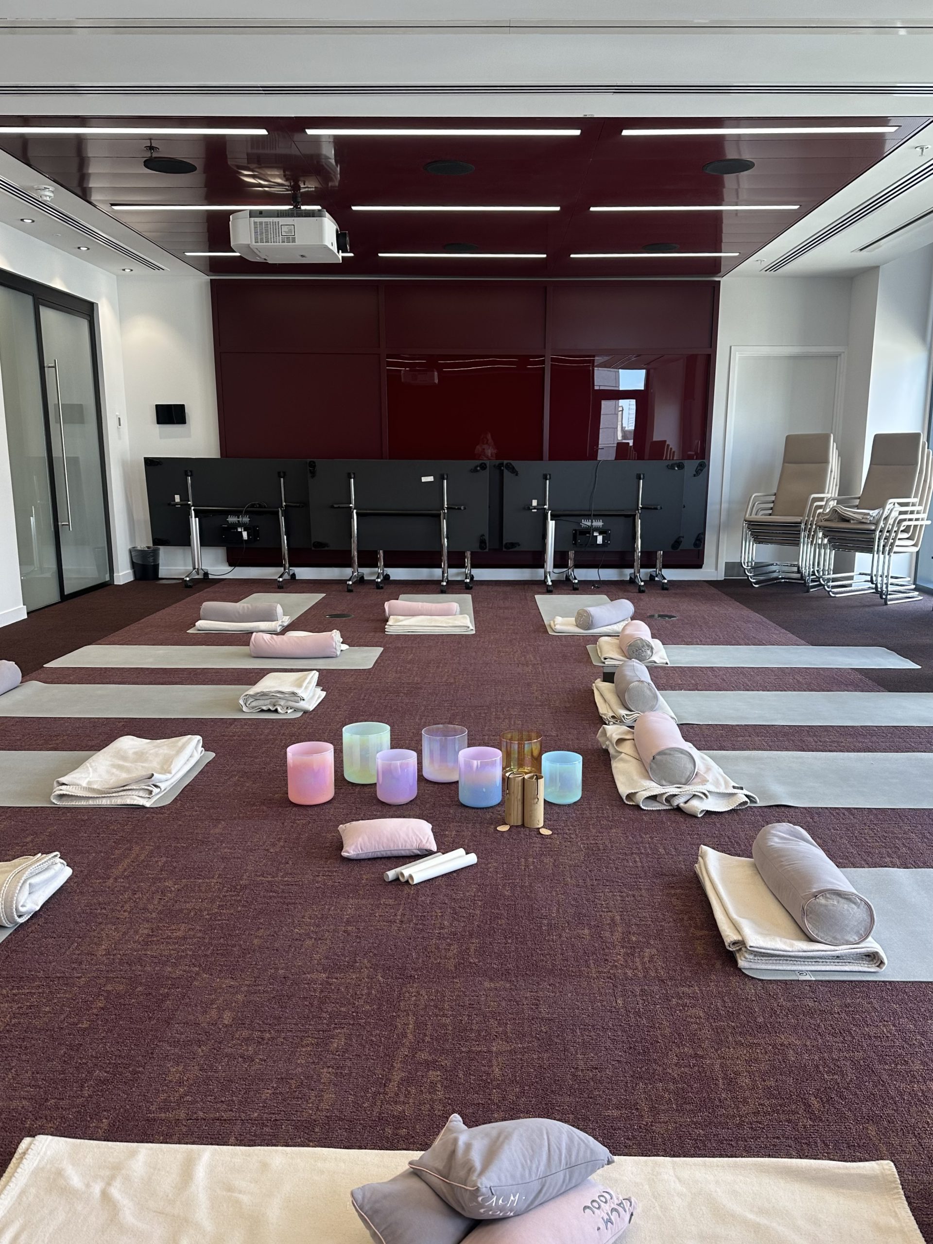 Yoga studio set up for relaxation with mats and candles