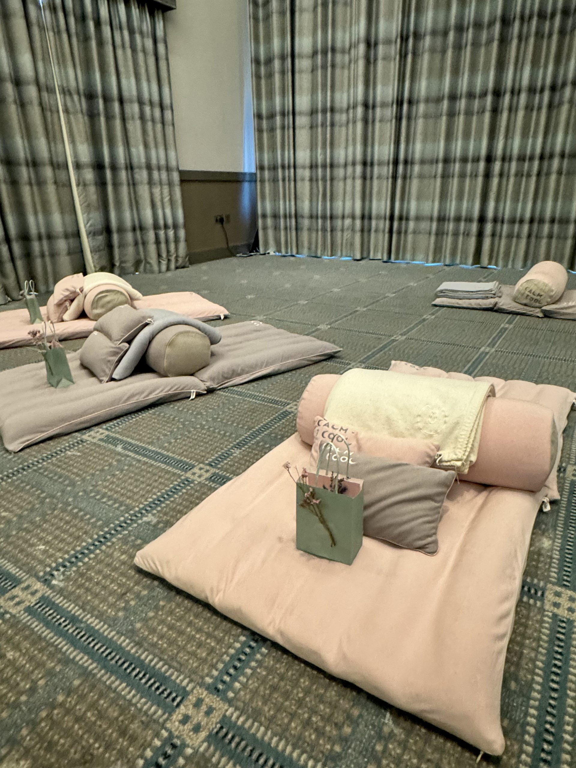 Cozy indoor spa setting with pillows and relaxation mats