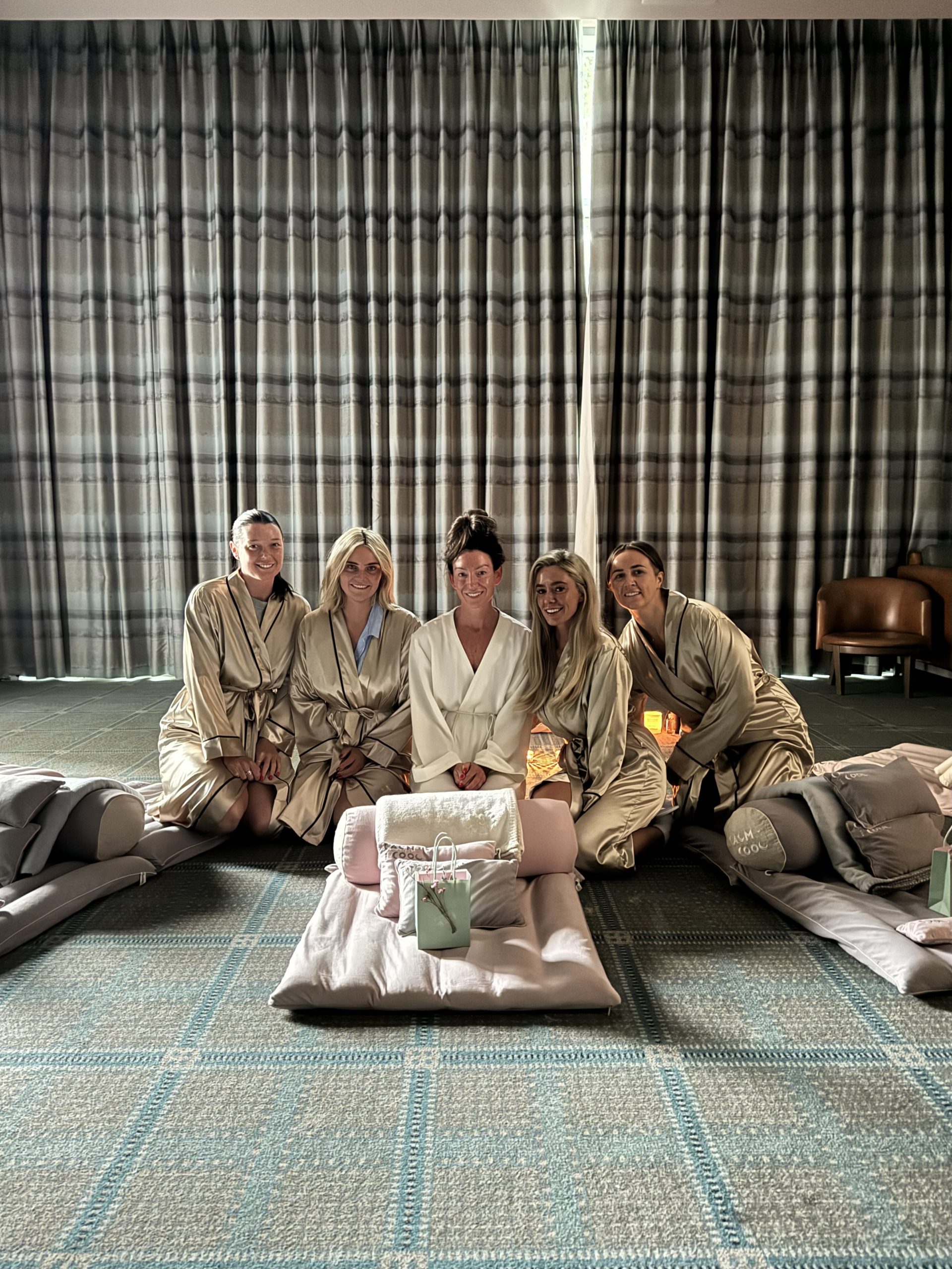 Group of women in robes enjoying a relaxing spa day indoors