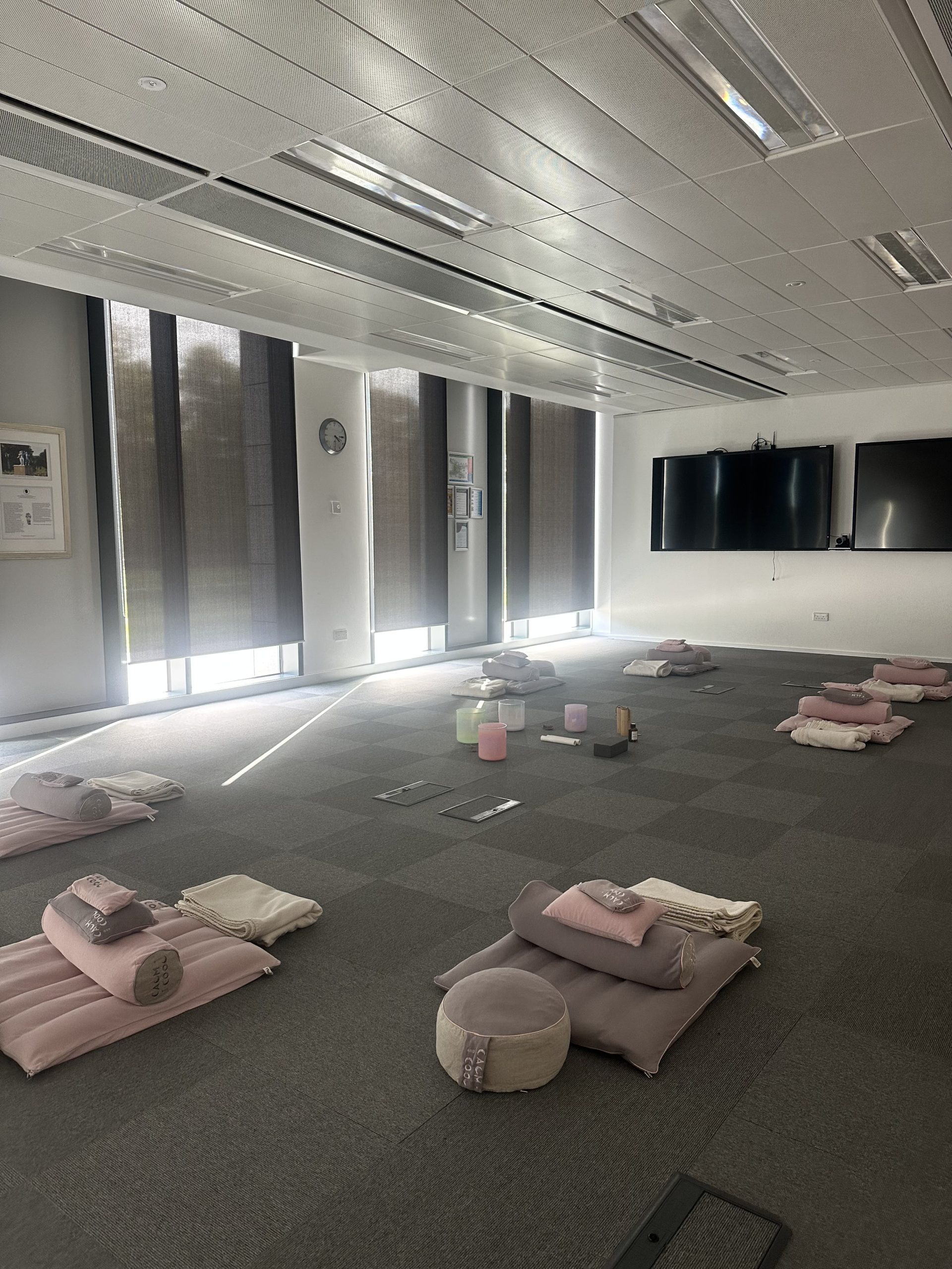 Modern meditation room with cushions and soft lighting